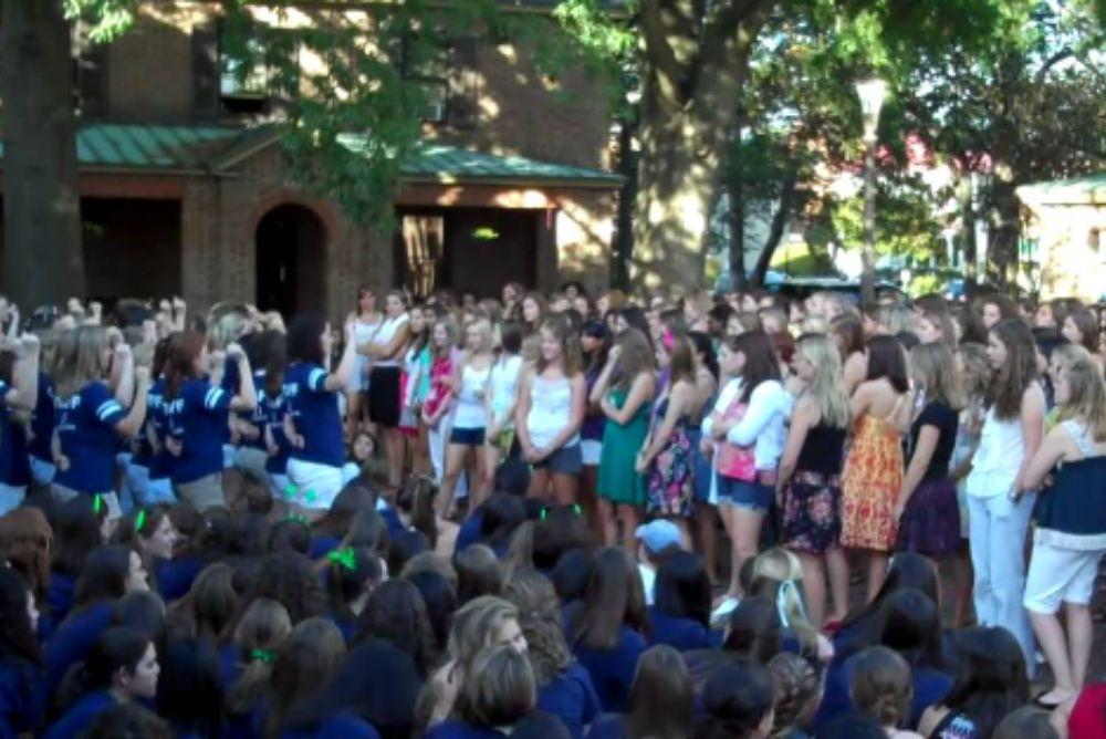 Chapters surrounding potential new members singing the Panhellenic toast in sorority court