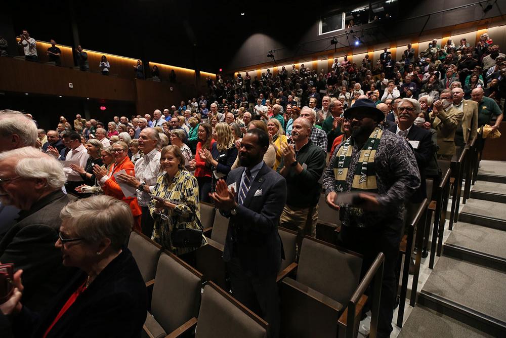 A photo of a crowd giving a standing ovation in Phi Beta Kappa Hall's theatre.