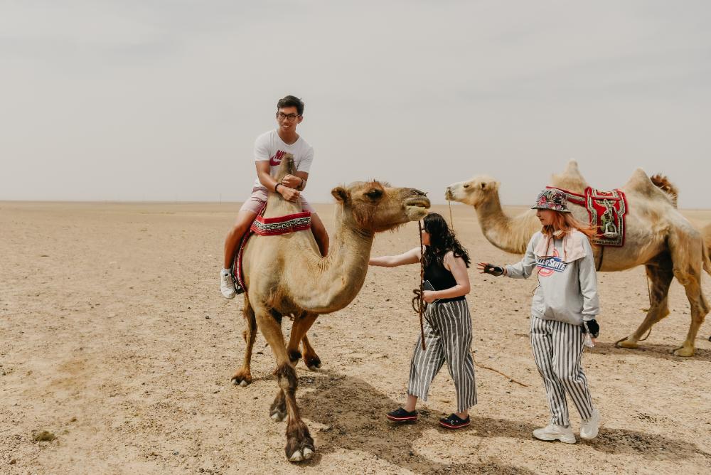 Sean Nguyen '25, a 2022 Freeman Fellow, on a camel during his fellowship.