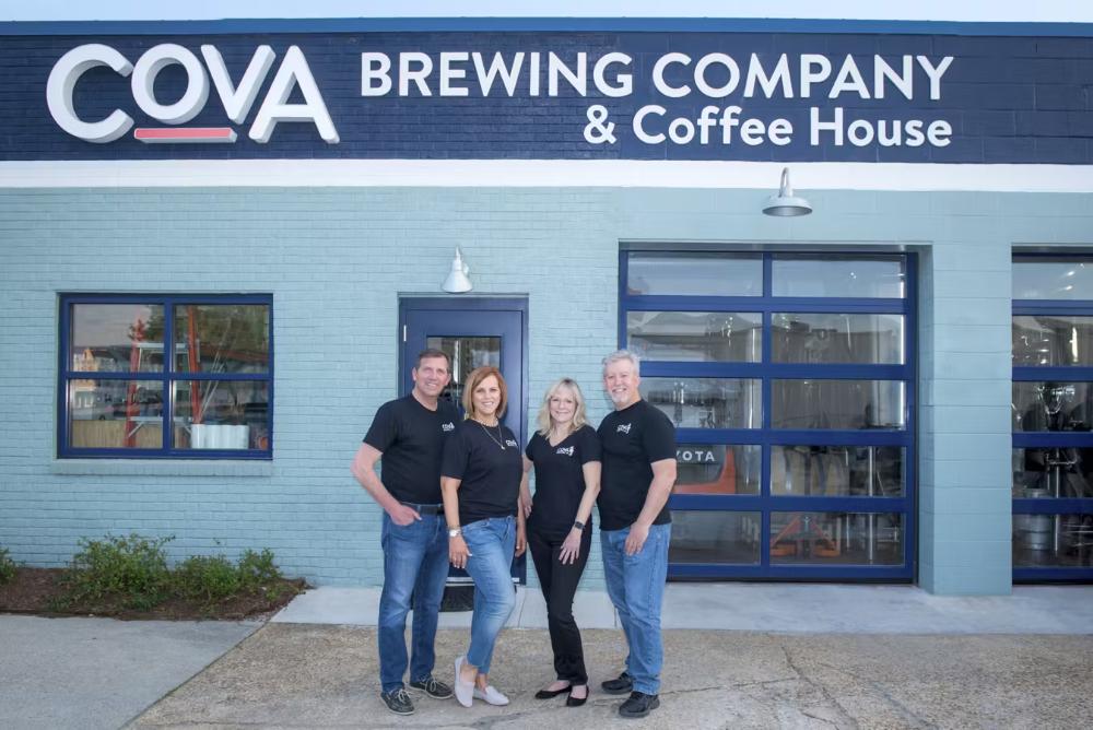 From left to right: Phil Smith, Karla Smith, Susan Bateman and Scott Bateman, COVA Brewing company co-founders standing outside venue..