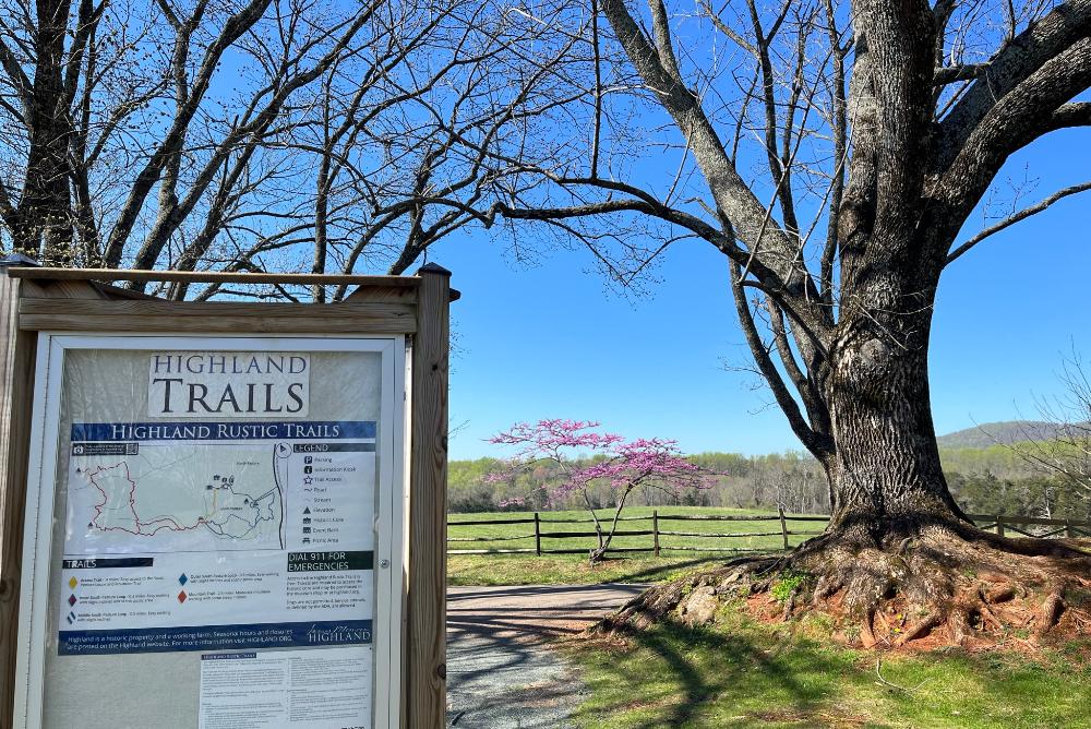 Highland Rustic Trails trailhead sign and pasture view