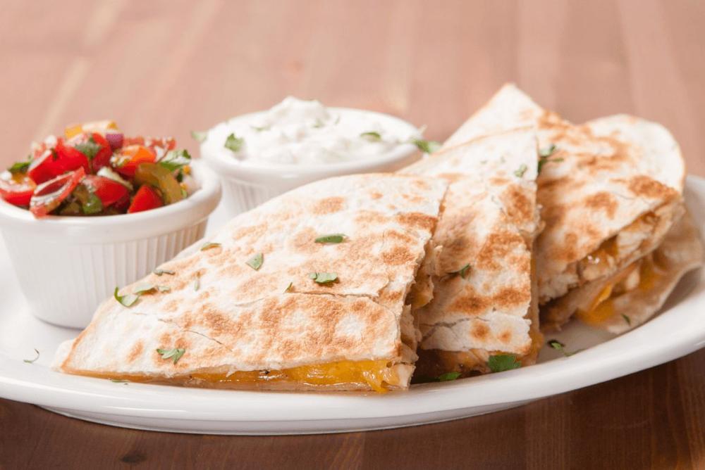 Enjoy a fresh quesadilla with sour cream and salsa--hand-delivered right to you!
