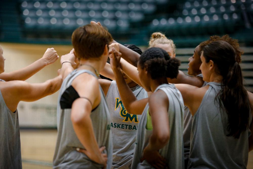 Tribe women's basketball huddles up after a workout.