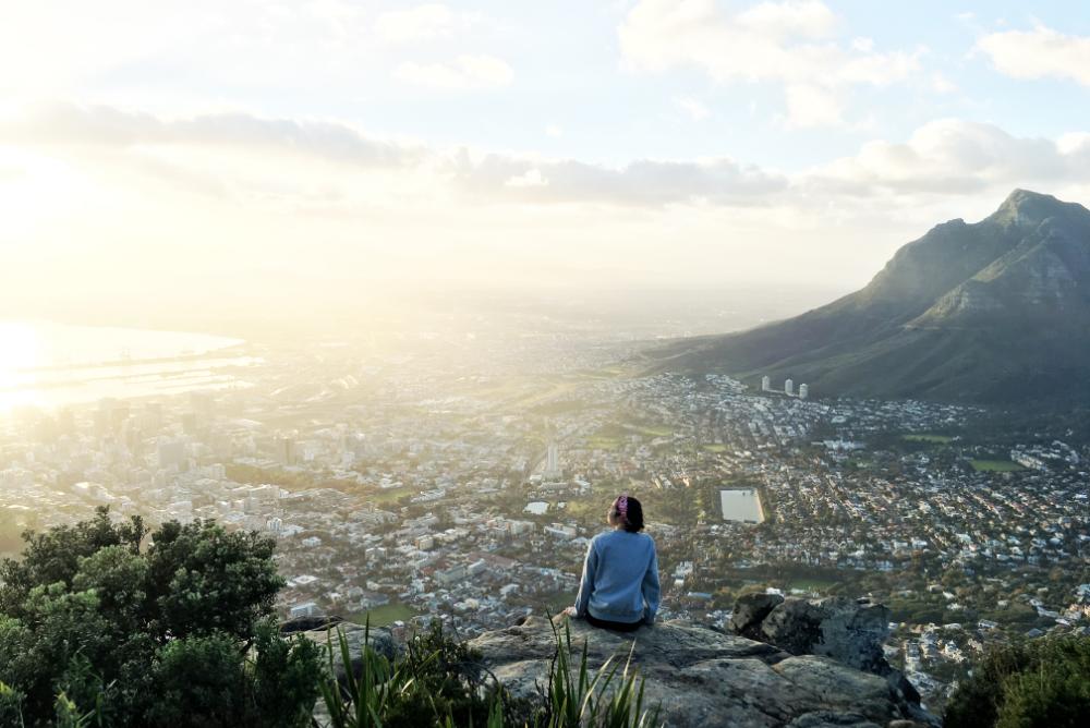 student watching a sunrise from above Cape Town