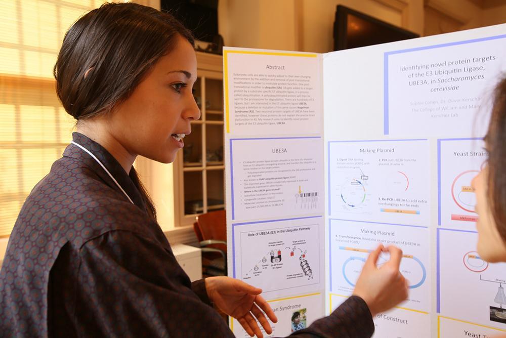 student presenting a trifold poster