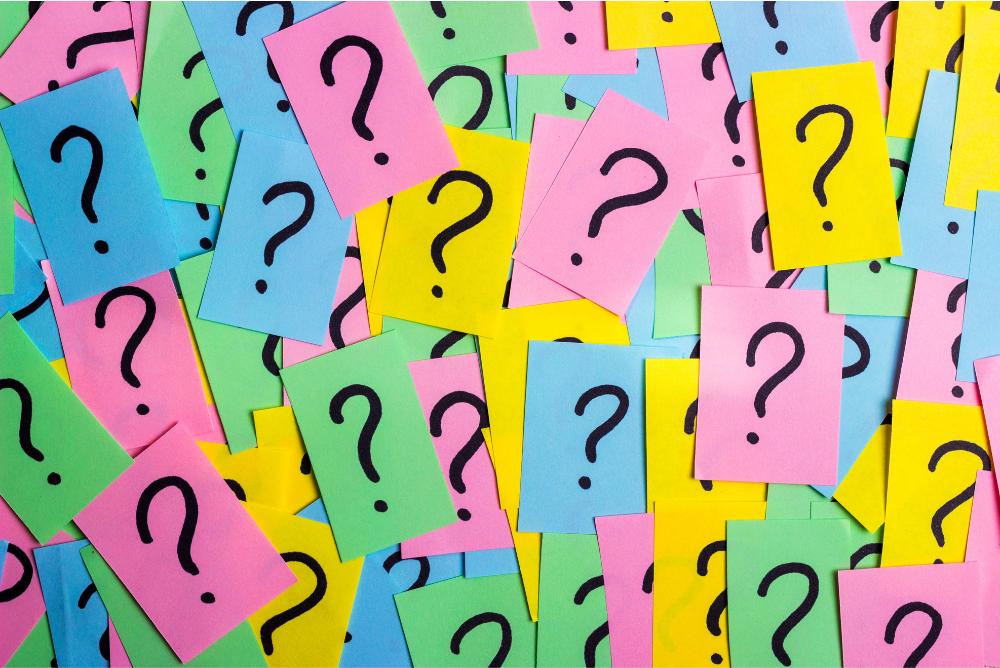 question marks on colorful sticky note