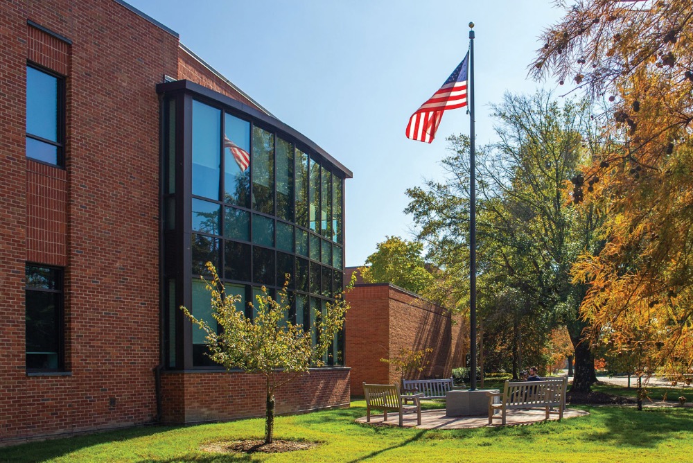 outside of law school with American flag