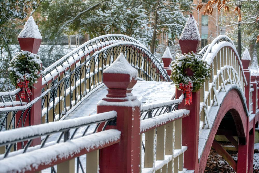 The Crim Dell Bridge dusted with snow and sporting two winter wreaths