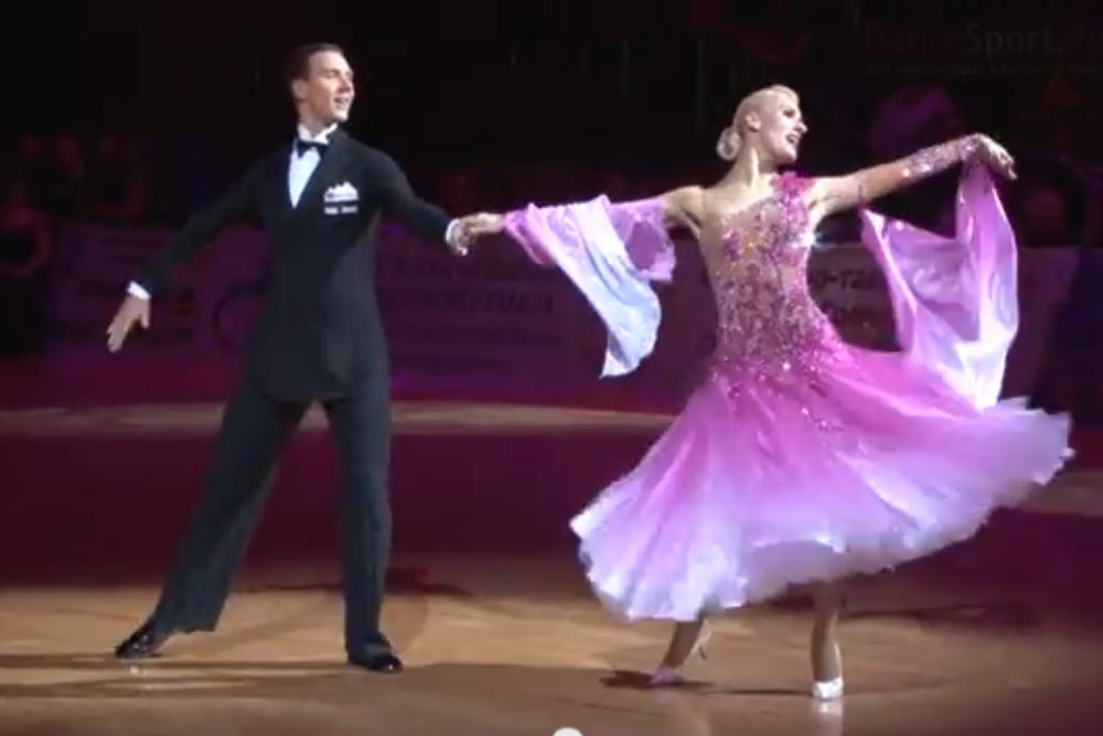 Two ballroom dancers side by side
