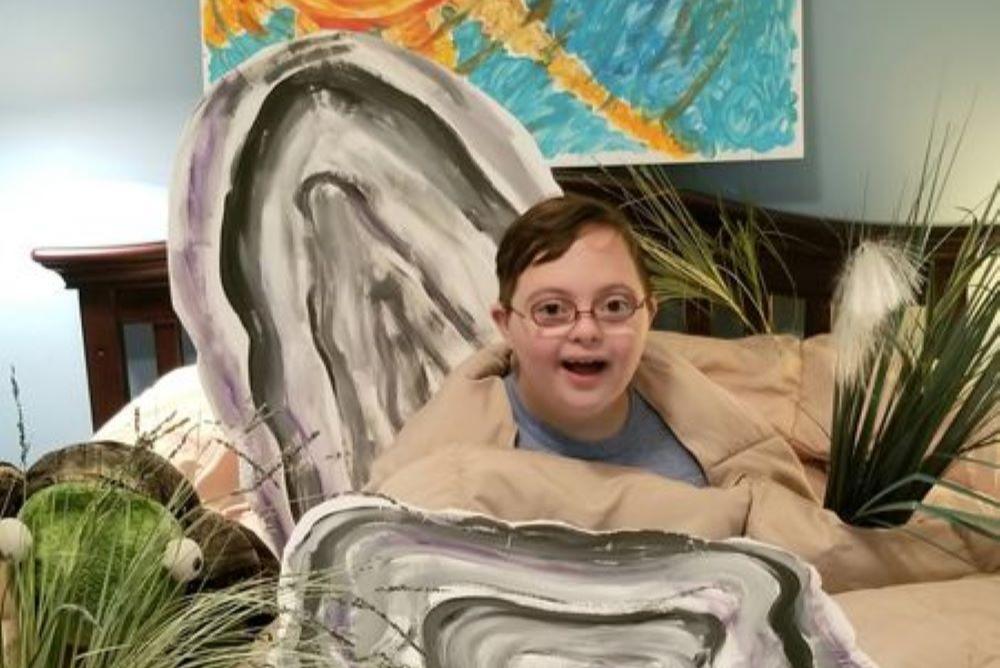 Quinn from Yorktown, VA dressed as an oyster bed for the 2020 Marine Life Costume Contest
