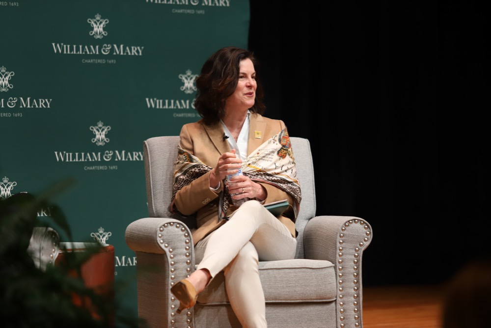 President Rowe seated during a conversation on-stage