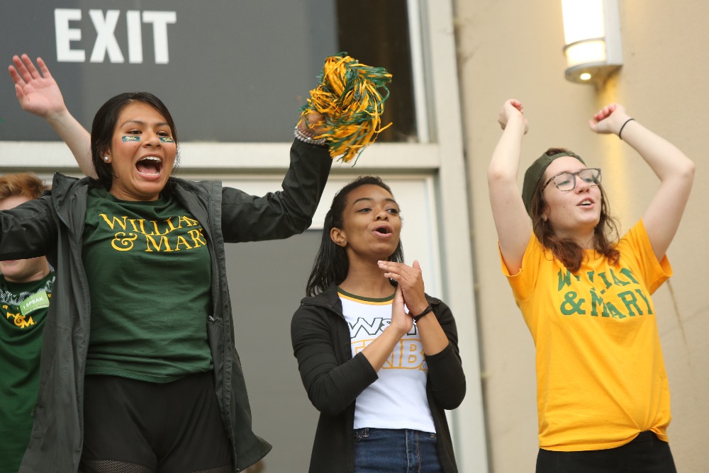 students in W&M gear cheering