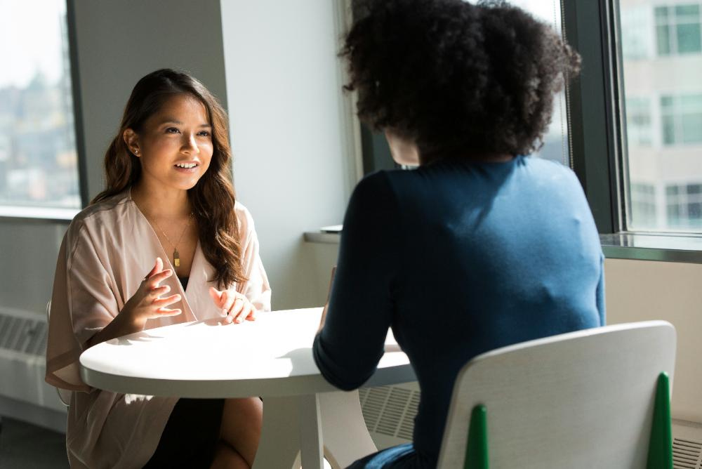 Two women communicating