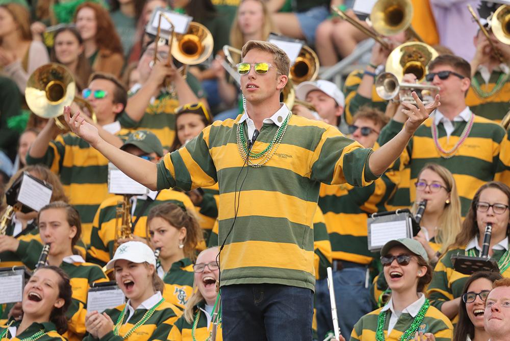 outdoors, people, pep band, students, zable stadium, tribe pride, green and gold